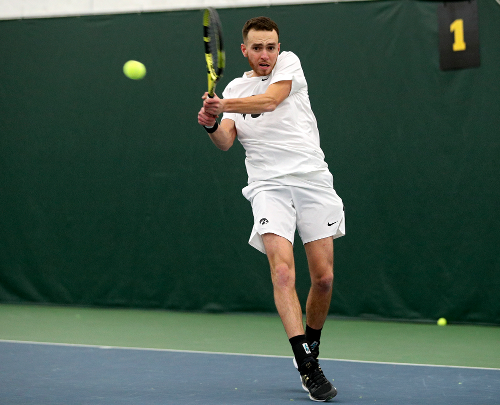 Iowa’s Kareem Allaf returns a shot during his singles match at the Hawkeye Tennis and Recreation Complex in Iowa City on Sunday, February 16, 2020. (Stephen Mally/hawkeyesports.com)