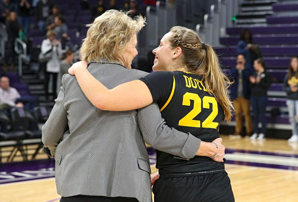 Iowa Hawkeyes head coach Lisa Bluder and guard Kathleen Doyle (22) share a laugh as they walk off the court after winning their game at Welsh-Ryan Arena in Evanston, Ill. on Sunday, January 5, 2020. (Stephen Mally/hawkeyesports.com)