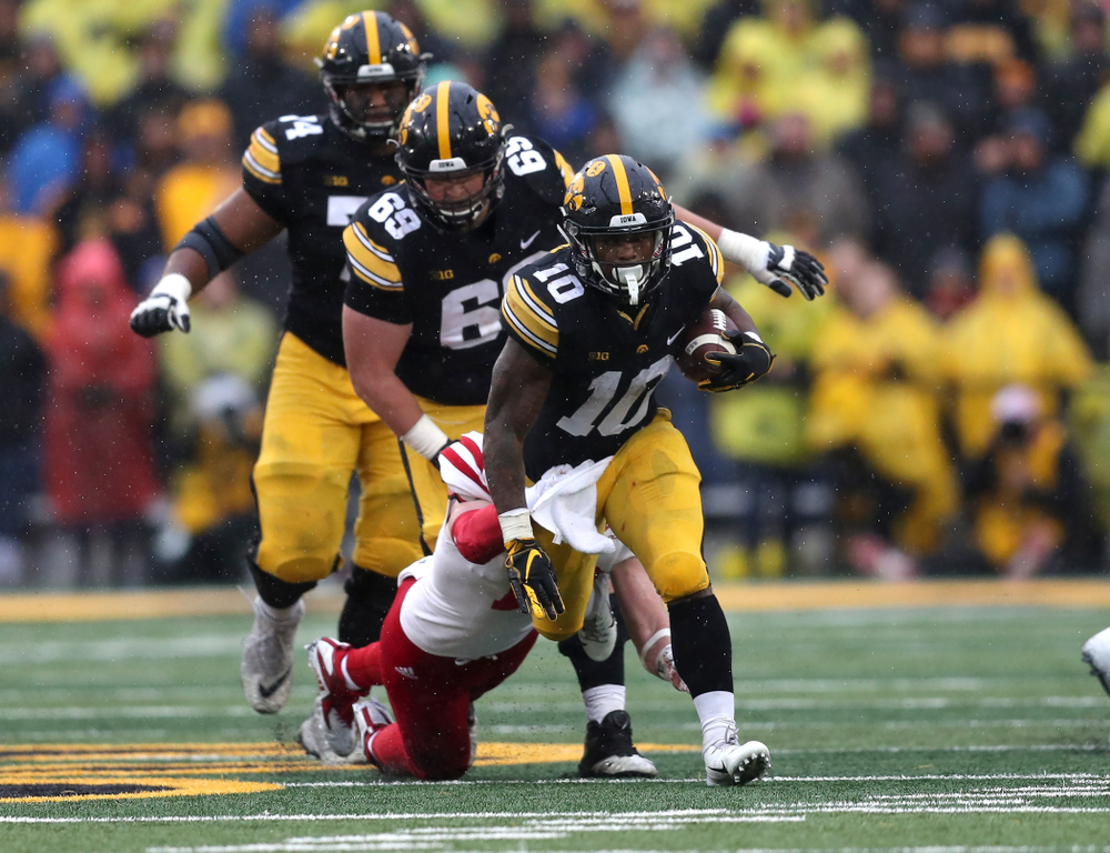 Iowa Hawkeyes running back Mekhi Sargent (10) carries the ball against the Nebraska Cornhuskers Friday, November 23, 2018 at Kinnick Stadium. (Brian Ray/hawkeyesports.com)