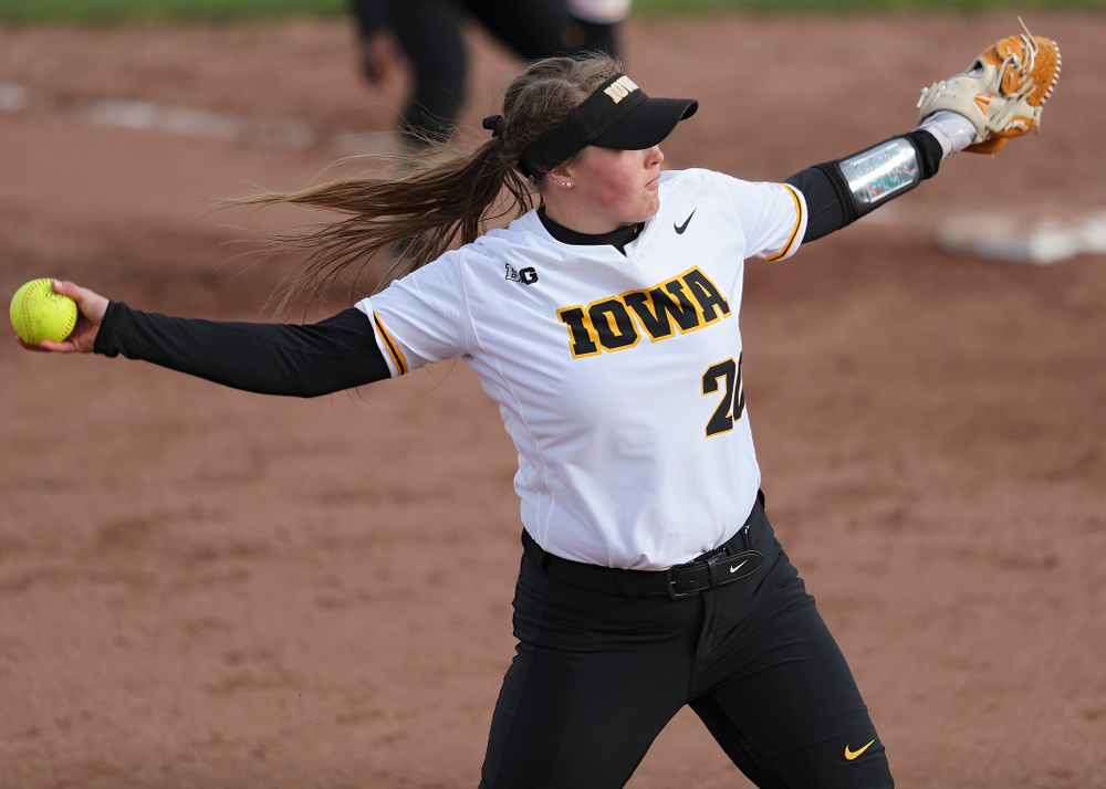 Iowa pitcher Miranda Schulte (20) delivers to the plate during the fifth inning of their game against Illinois at Pearl Field in Iowa City on Friday, Apr. 12, 2019. (Stephen Mally/hawkeyesports.com)