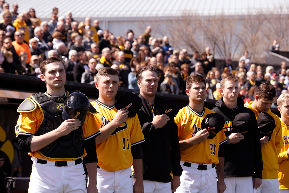 Iowa Hawkeyes catcher Brett McCleary (32), pitcher Cole McDonald (11), and pitcher Nick Allgeyer (24) before their game against the Michigan Wolverines Sunday, April 29, 2018 at Duane Banks Field. (Brian Ray/hawkeyesports.com)