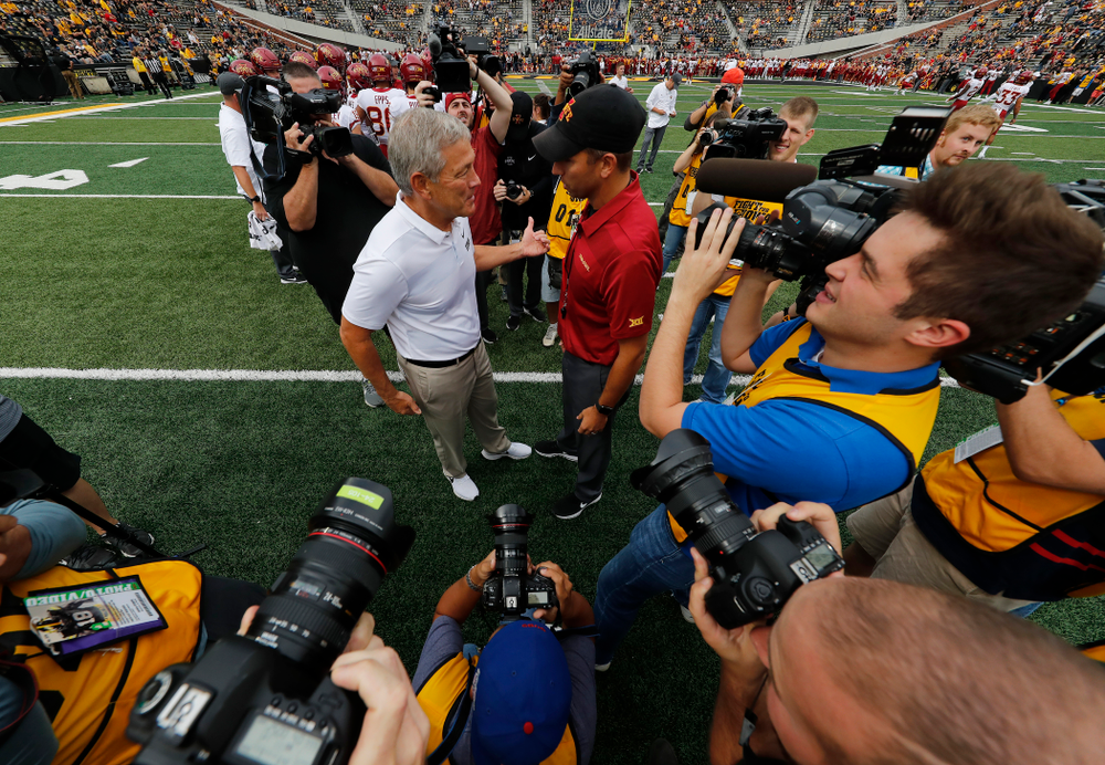 Iowa Hawkeyes head coach Kirk Ferentz talks with Iowa State Cyclones head coach Matt Campbell before their game Saturday, September 8, 2018 at Kinnick Stadium. (Brian Ray/hawkeyesports.com)