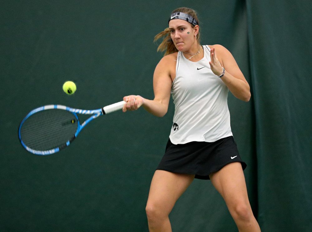 Iowa’s Ashleigh Jacobs returns a shot during her singles match at the Hawkeye Tennis and Recreation Complex in Iowa City on Sunday, February 16, 2020. (Stephen Mally/hawkeyesports.com)