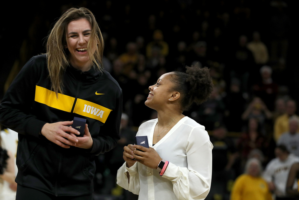 Former Hawkeye and Clemson graduate assistant Tania Davis and former Hawkeye Hannah Stewart react after receiving their against Big Ten Tournament championship rings before the Hawkeye game against Clemson Wednesday, December 4, 2019 at Carver-Hawkeye Arena. (Brian Ray/hawkeyesports.com)