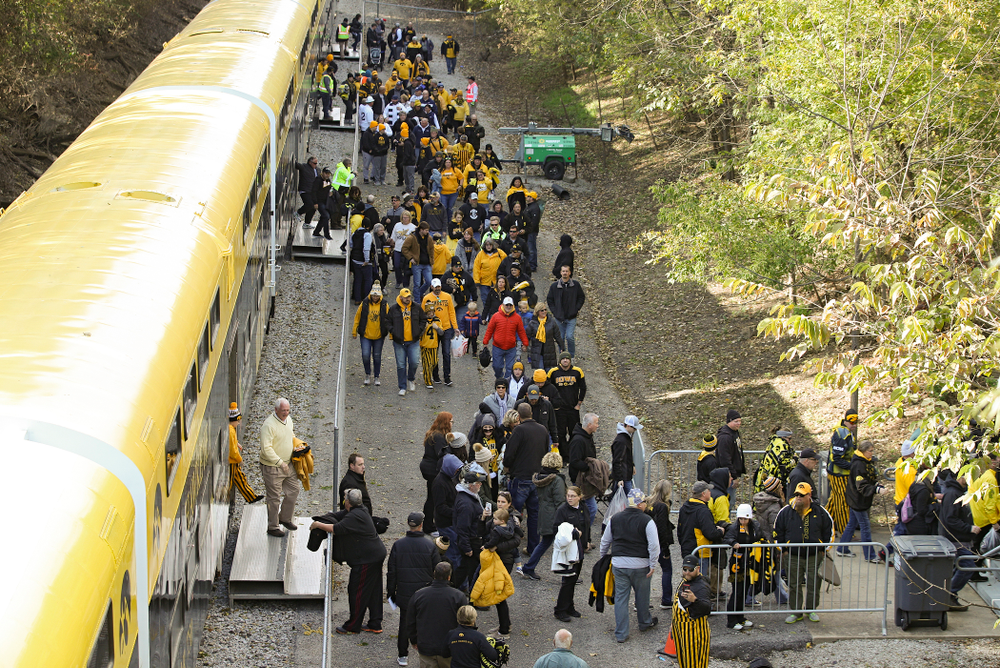 Fan make their way off the Hawkeye Express before the game at Kinnick Stadium in Iowa City on Saturday, Oct 12, 2019. (Stephen Mally/hawkeyesports.com)