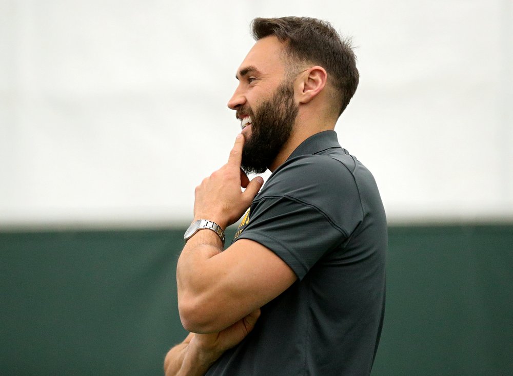 Iowa’s assistant coach Lloyd Bruce-Burgess looks on during a singles match at the Hawkeye Tennis and Recreation Complex in Iowa City on Friday, February 14, 2020. (Stephen Mally/hawkeyesports.com)