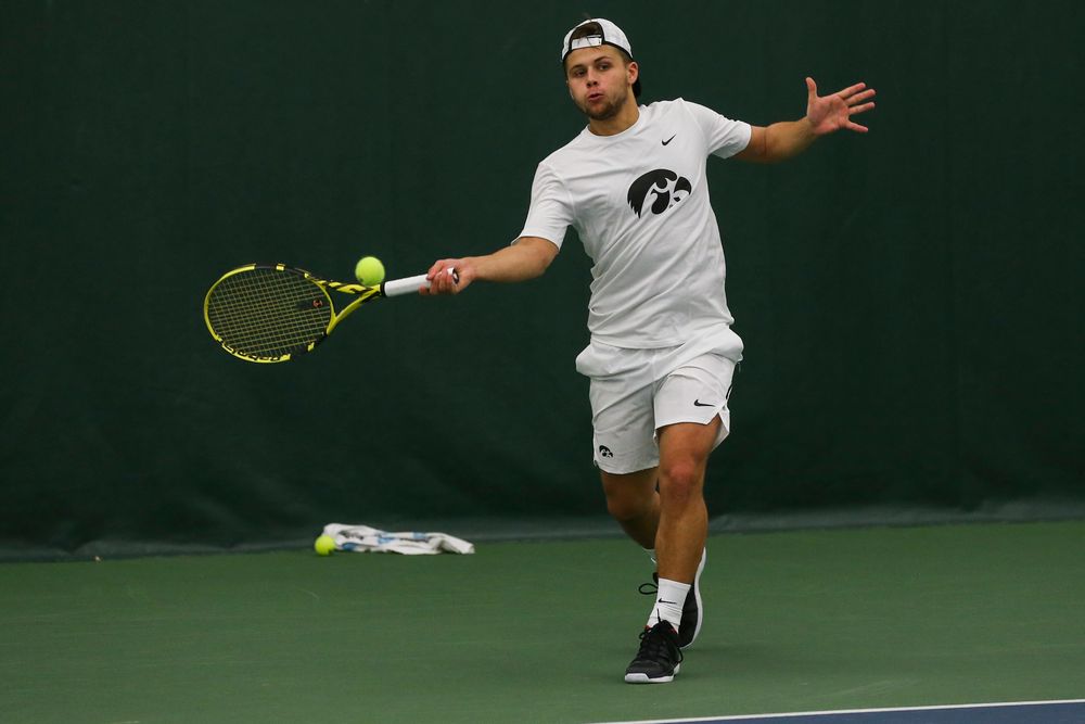 Iowa’s Will Davies hits a forehand during the Iowa men’s tennis match vs Western Michigan on Saturday, January 18, 2020 at the Hawkeye Tennis and Recreation Complex. (Lily Smith/hawkeyesports.com)