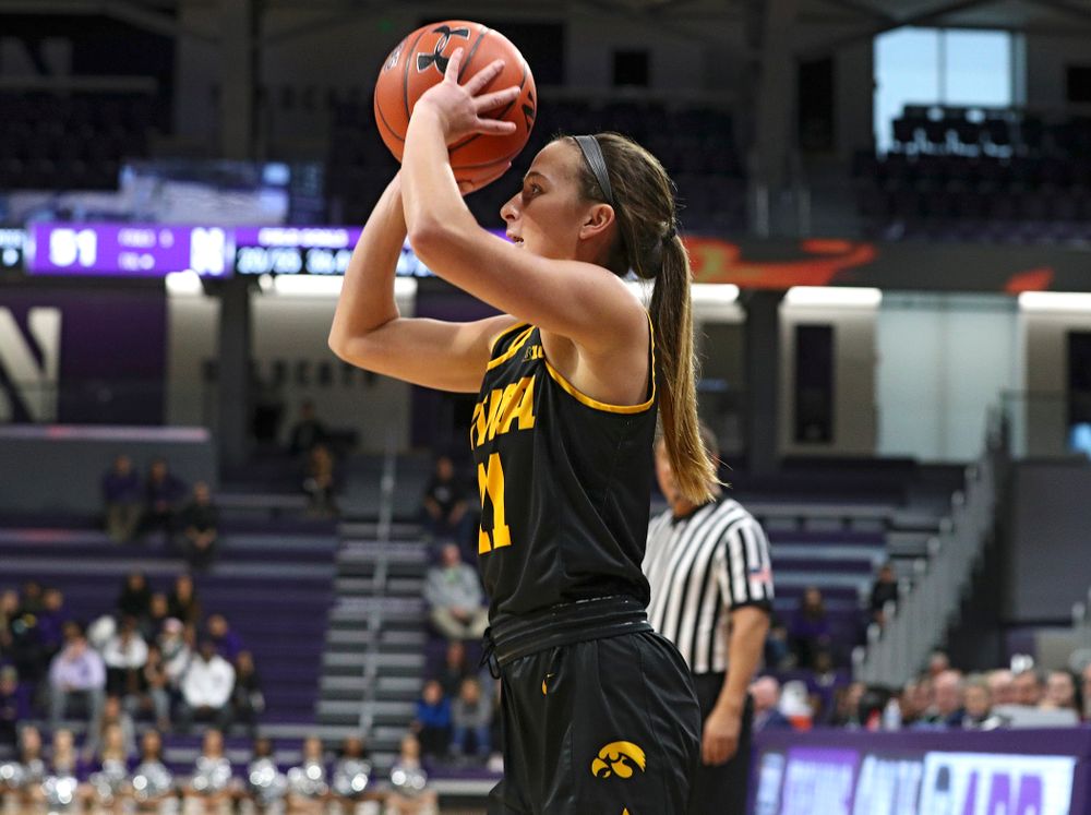 Iowa Hawkeyes guard Megan Meyer (11) makes a 3-pointer during the fourth quarter of their game at Welsh-Ryan Arena in Evanston, Ill. on Sunday, January 5, 2020. (Stephen Mally/hawkeyesports.com)