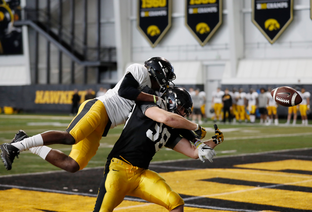 Iowa Hawkeyes defensive back Michael Ojemudia (11) and tight end T.J. Hockenson (38) Wednesday, April 4, 2018 at the Hansen Football Performance Center. (Brian Ray/hawkeyesports.com)