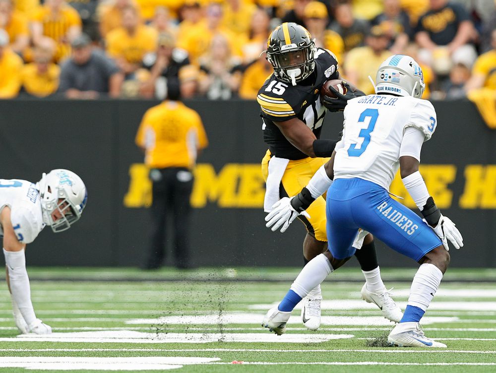 Iowa Hawkeyes running back Tyler Goodson (15) jukes a defender during fourth quarter of their game at Kinnick Stadium in Iowa City on Saturday, Sep 28, 2019. (Stephen Mally/hawkeyesports.com)