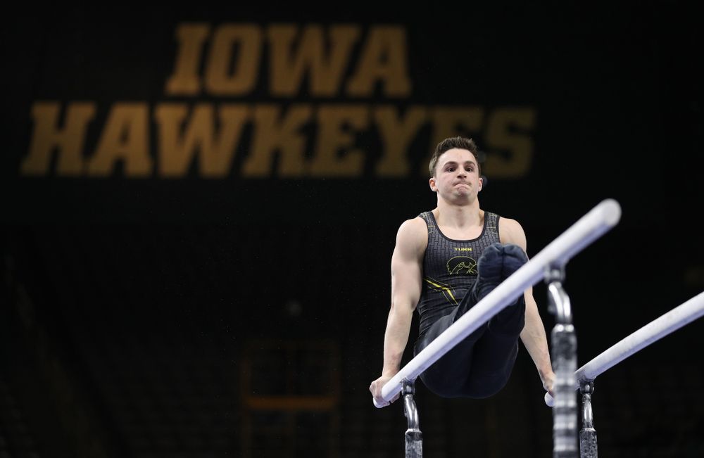 Iowa's Jake Brodarzon competes on the parallel bars against the Ohio State Buckeyes Saturday, March 16, 2019 at Carver-Hawkeye Arena. (Brian Ray/hawkeyesports.com)