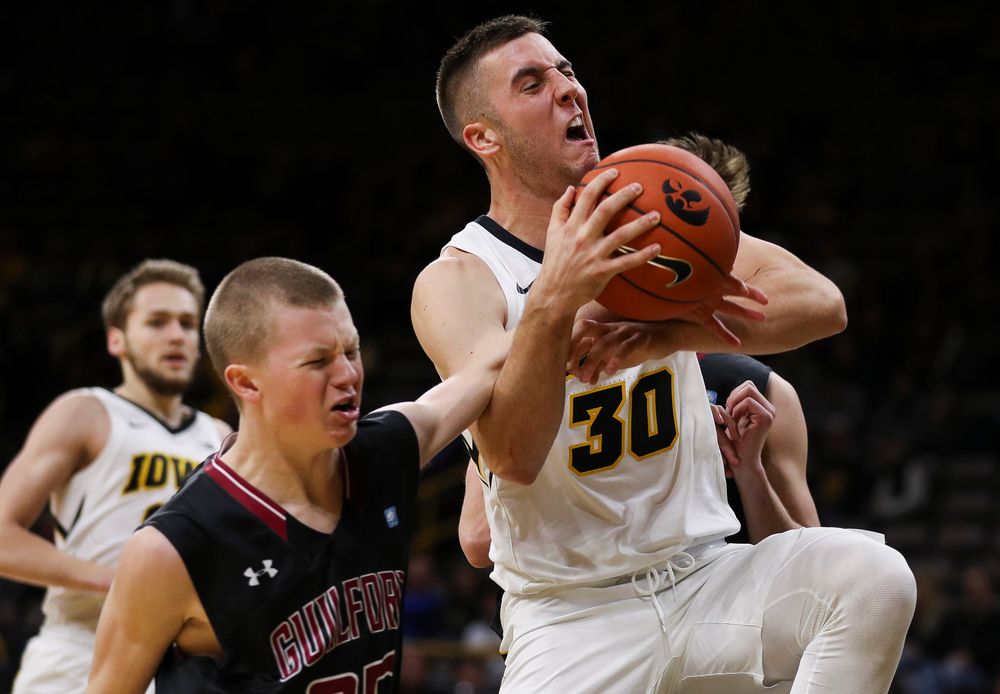 Iowa Hawkeyes guard Connor McCaffery (30) is intentionally fouled on his way to the rim during a game against Guilford College at Carver-Hawkeye Arena on November 4, 2018. (Tork Mason/hawkeyesports.com)