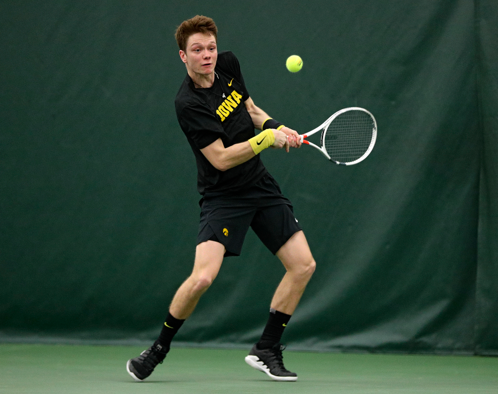 Iowa’s Jason Kerst returns a shot during his singles match at the Hawkeye Tennis and Recreation Complex in Iowa City on Friday, March 6, 2020. (Stephen Mally/hawkeyesports.com)
