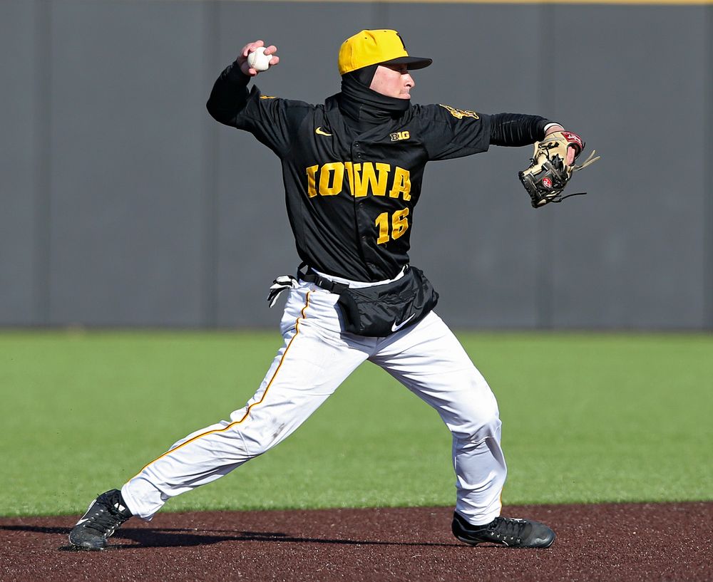 Iowa Hawkeyes shortstop Tanner Wetrich (16) throws to first base for an out during the ninth inning of their game against Illinois at Duane Banks Field in Iowa City on Saturday, Mar. 30, 2019. (Stephen Mally/hawkeyesports.com)