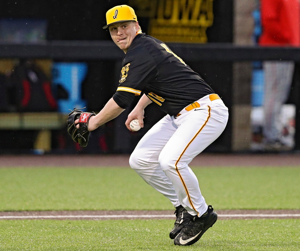 Iowa Hawkeyes pitcher Derek Lieurance (10) throws to first during the ninth inning of their game against Illinois State at Duane Banks Field in Iowa City on Wednesday, Apr. 3, 2019. (Stephen Mally/hawkeyesports.com)