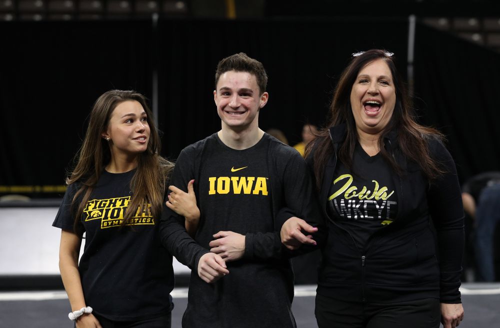 Iowa Men's Gymnast Jake Brodarzon and his family during senior day ceremonies following their meet against the Ohio State Buckeyes Saturday, March 16, 2019 at Carver-Hawkeye Arena. (Brian Ray/hawkeyesports.com)