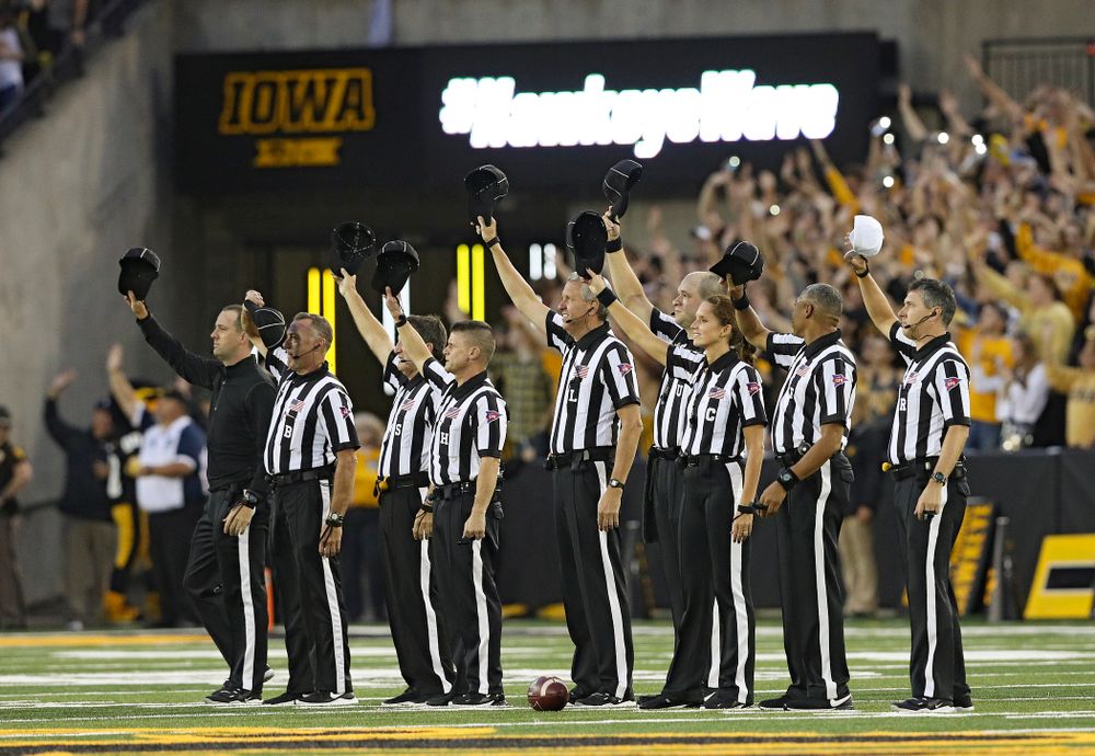 The officials wave to the University of Iowa Stead Family Children’s Hospital between the first and second quarter of their game at Kinnick Stadium in Iowa City on Saturday, Aug 31, 2019. (Stephen Mally/hawkeyesports.com)