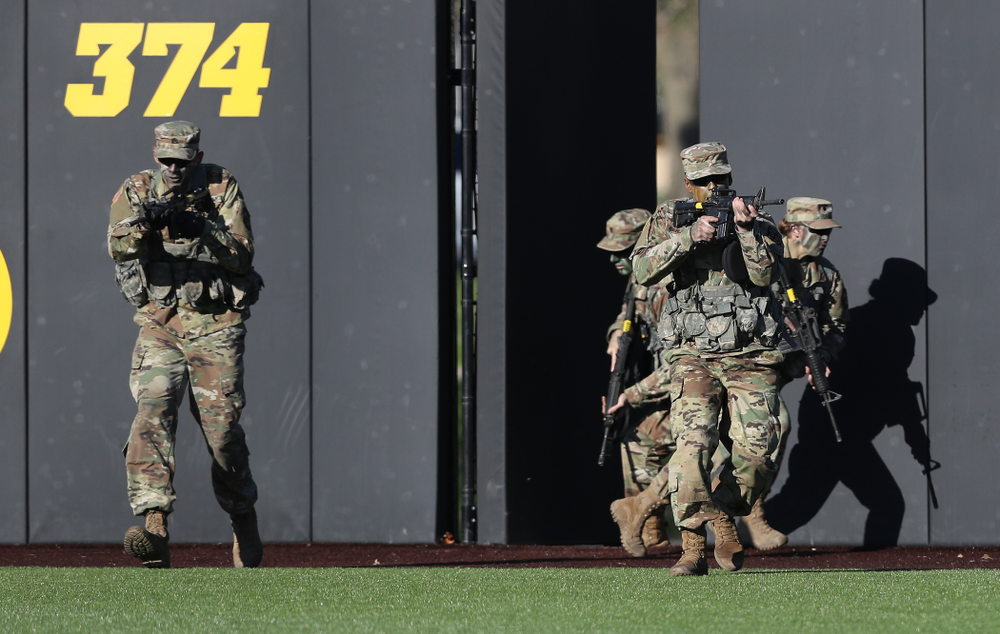 Members of the University of Iowa ROTC deliver the game ball before the Iowa Hawkeyes game against the Nebraska Cornhuskers on Military Appreciation Night Friday, April 19, 2019 at Duane Banks Field. (Brian Ray/hawkeyesports.com)