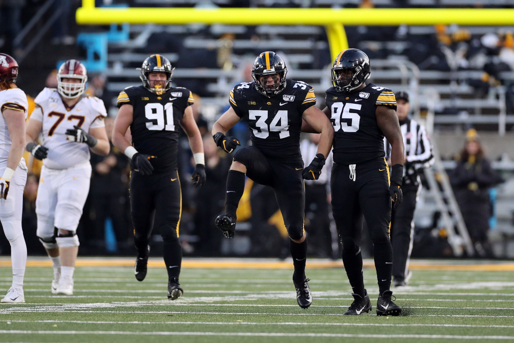 Iowa Hawkeyes linebacker Kristian Welch (34) gets a sack against the Minnesota Golden Gophers Saturday, November 16, 2019 at Kinnick Stadium. (Brian Ray/hawkeyesports.com)