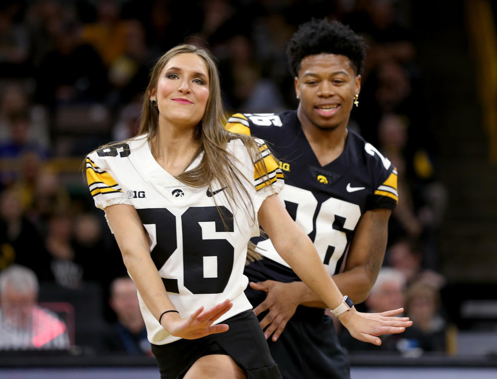 Members of the Hawkeye Football team performs with the Iowa Dance Team at halftime of the Iowa Hawkeyes game against the Ohio State Buckeyes Thursday, February 20, 2020 at Carver-Hawkeye Arena. (Brian Ray/hawkeyesports.com)