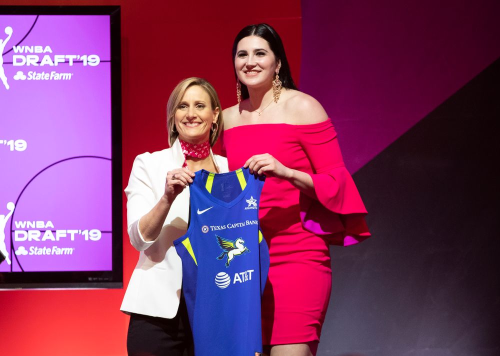 Iowa Hawkeyes forward Megan Gustafson (10) holds up a jersey after being selected by the Dallas Wings in the second round of the 2019 WNBA Draft Wednesday, April 10, 2019 at Nike New York Headquarters in New York City. (Brian Ray/hawkeyesports.com)