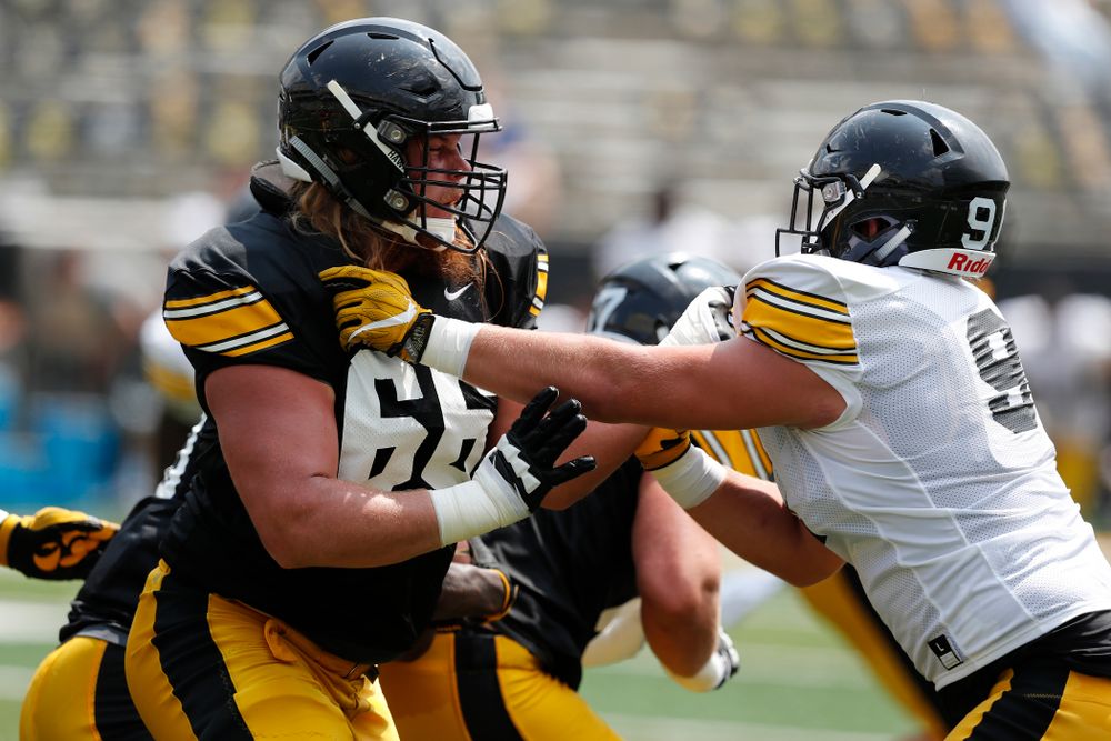 Iowa Hawkeyes offensive lineman Levi Paulsen (66) and defensive lineman Brady Reiff (91) during Kids Day Saturday, August 11, 2018 at Kinnick Stadium. (Brian Ray/hawkeyesports.com)