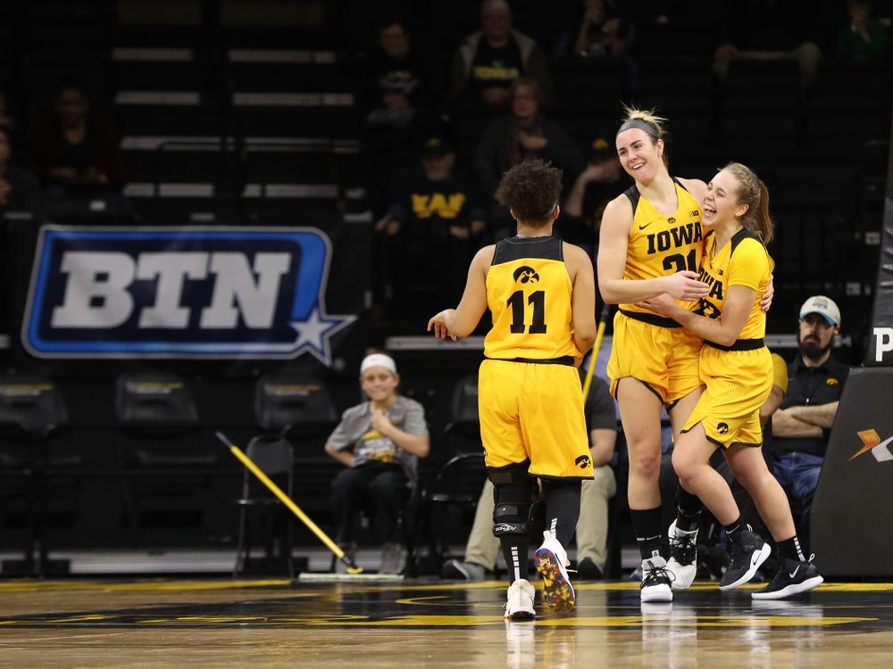 Iowa Hawkeyes forward Hannah Stewart (21) and guard Kathleen Doyle (22) against the Michigan State Spartans Thursday, February 7, 2019 at Carver-Hawkeye Arena. (Brian Ray/hawkeyesports.com)