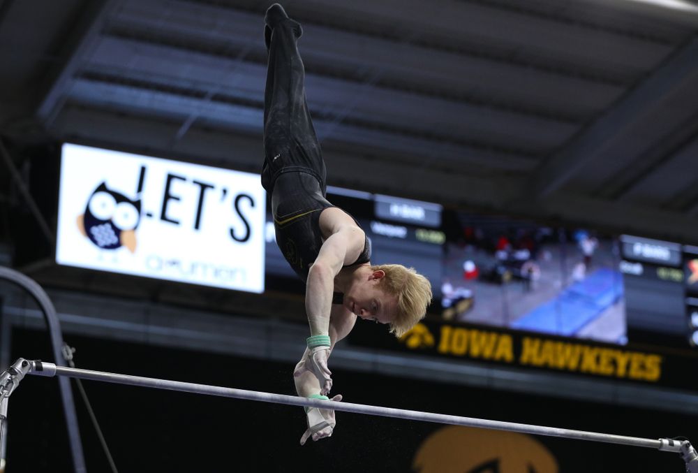 Iowa's Nick Merryman competes on the high bar against the Ohio State Buckeyes Saturday, March 16, 2019 at Carver-Hawkeye Arena. (Brian Ray/hawkeyesports.com)