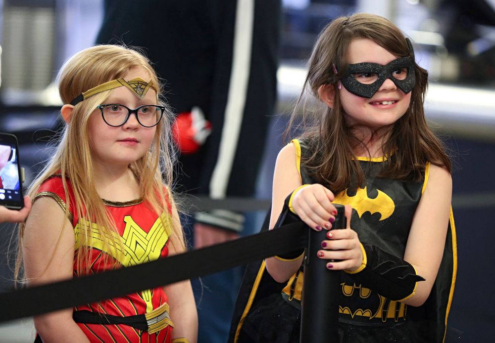 Two young fans wait in line on Superhero and Princess Day before the meet at Carver-Hawkeye Arena in Iowa City on Sunday, March 8, 2020. (Stephen Mally/hawkeyesports.com)