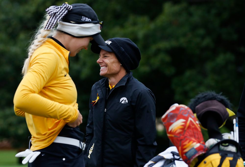 Iowa head coach Megan Menzel shares a laugh with Shawn Rennegarbe at the eighth tee during the Diane Thomason Invitational at Finkbine Golf Course on September 29, 2018. (Tork Mason/hawkeyesports.com)