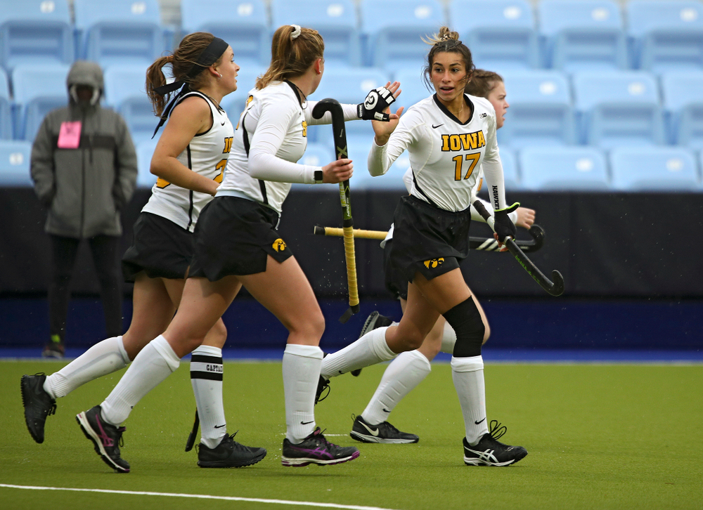 Iowa’s Ciara Smith (17) gets a high-five from Makenna Maguire (21) as she runs with Maddy Murphy (26) and Meghan Conroy (5) after Smith scored a goal during the first quarter of their NCAA Tournament First Round match against Duke at Karen Shelton Stadium in Chapel Hill, N.C. on Friday, Nov 15, 2019. (Stephen Mally/hawkeyesports.com)