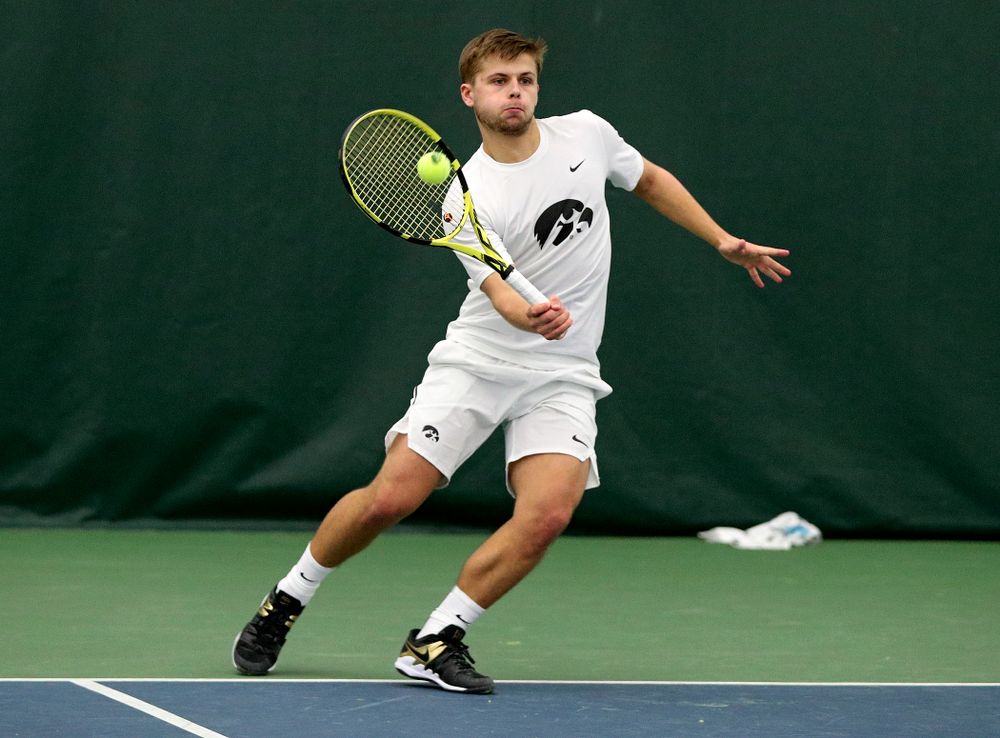 Iowa’s Will Davies returns a shot during his singles match at the Hawkeye Tennis and Recreation Complex in Iowa City on Sunday, February 16, 2020. (Stephen Mally/hawkeyesports.com)