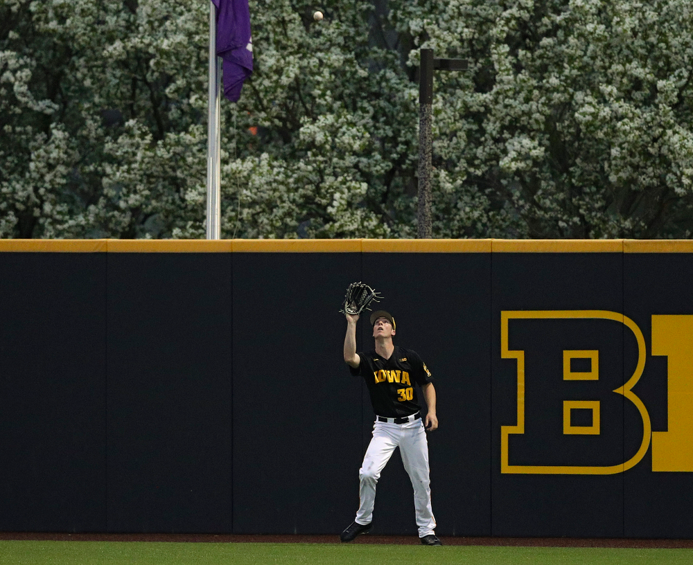 Iowa Hawkeyes right fielder Connor McCaffery (30) looks in a fly ball for an out during the fifth inning of their game against Western Illinois at Duane Banks Field in Iowa City on Wednesday, May. 1, 2019. (Stephen Mally/hawkeyesports.com)