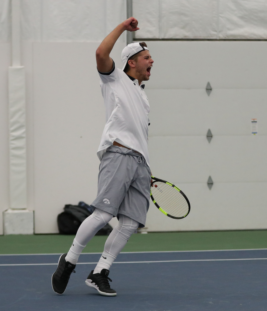 Iowa's Will Davies and Oliver Okonkwo celebrate after winning a doubles match against Western Michigan Saturday, January 19, 2019 at the Hawkeye Tennis and Recreation Complex. (Brian Ray/hawkeyesports.com)