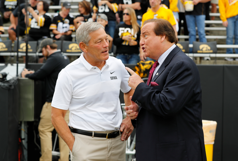 Iowa Hawkeyes head coach Kirk Ferentz talks with Tim Brando before their game against the Iowa State Cyclones Saturday, September 8, 2018 at Kinnick Stadium. (Brian Ray/hawkeyesports.com)
