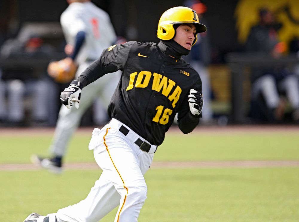 Iowa Hawkeyes shortstop Tanner Wetrich (16) runs after hitting a 2-RBI single during the second inning of their game against Illinois at Duane Banks Field in Iowa City on Saturday, Mar. 30, 2019. (Stephen Mally/hawkeyesports.com)