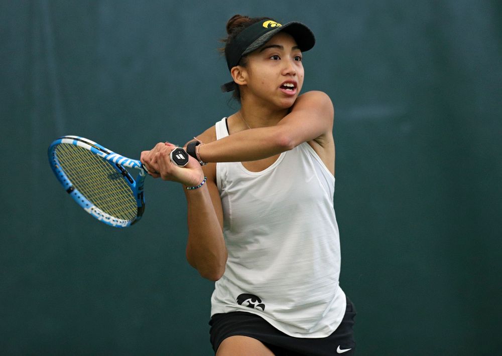 Iowa’s Michelle Bacalla returns a shot during her singles match at the Hawkeye Tennis and Recreation Complex in Iowa City on Sunday, February 23, 2020. (Stephen Mally/hawkeyesports.com)