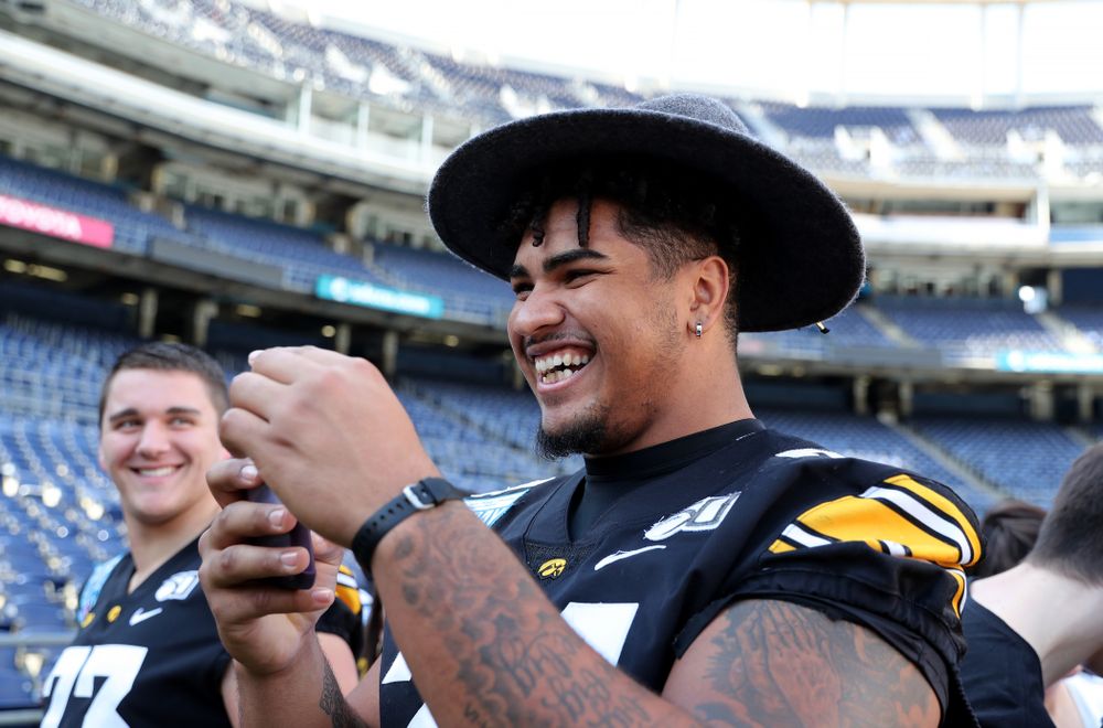 Iowa Hawkeyes offensive lineman Tristan Wirfs (74) following the team photo Wednesday, December 25, 2019 at SDCCU Stadium in San Diego. (Brian Ray/hawkeyesports.com)