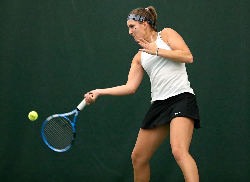 Iowa’s Ashleigh Jacobs returns a shot during her singles match at the Hawkeye Tennis and Recreation Complex in Iowa City on Sunday, February 16, 2020. (Stephen Mally/hawkeyesports.com)