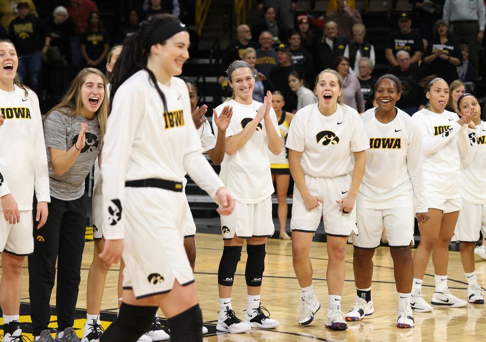 Iowa Hawkeyes forward Megan Gustafson (10) receives a pair of commemorative basketballs from head coach Lisa Bluder for becoming the school's all time rebounds leader and scoring leader before their gam eagainst the Nebraska Cornhuskers Thursday, January 3, 2019 at Carver-Hawkeye Arena. (Brian Ray/hawkeyesports.com)