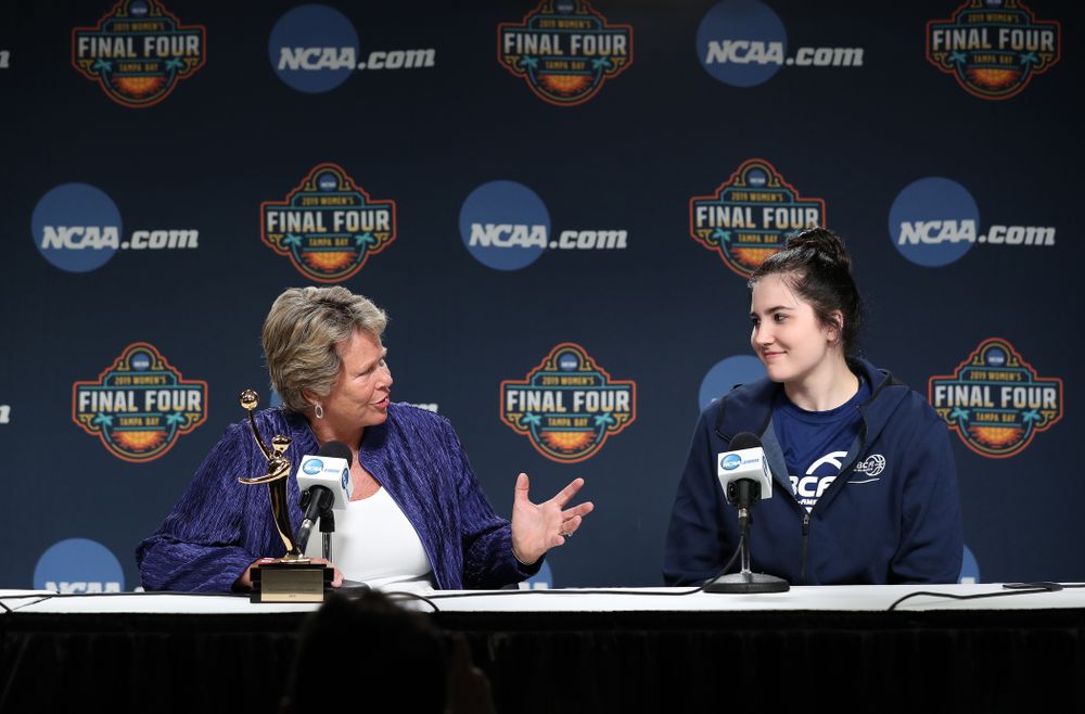 Iowa Hawkeyes forward Megan Gustafson (10) receives US Basketball Writers Association Ann Meyers Drysdale Player of the Year award from Ann Meyers Drysdale during a news conference Friday, April 5, 2019 at Amalie Arena in Tampa, FL. (Brian Ray/hawkeyesports.com)