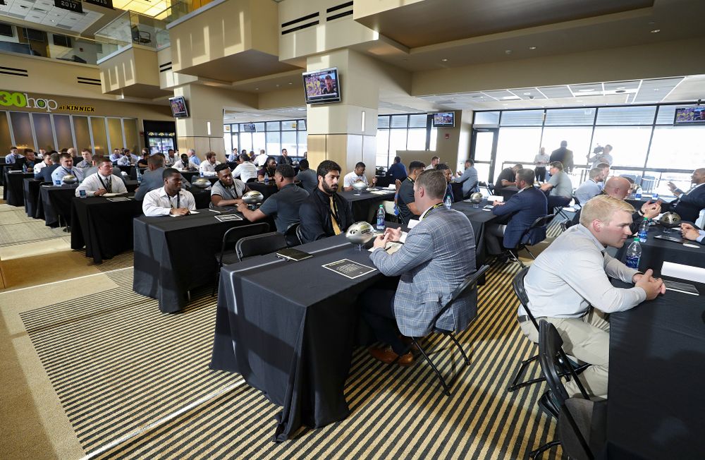 Former players meet with members of the current Hawkeye Football team during a networking event at Kinnick Stadium in Iowa City on Thursday, Jun 6, 2019. (Stephen Mally/hawkeyesports.com)