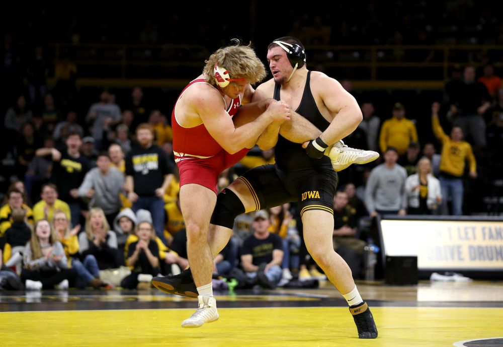 IowaÕs Tony Cassioppi wrestles WisconsinÕs Trent Hillger at heavyweight Sunday, December 1, 2019 at Carver-Hawkeye Arena. Cassioppi won the match 3-2. (Brian Ray/hawkeyesports.com)