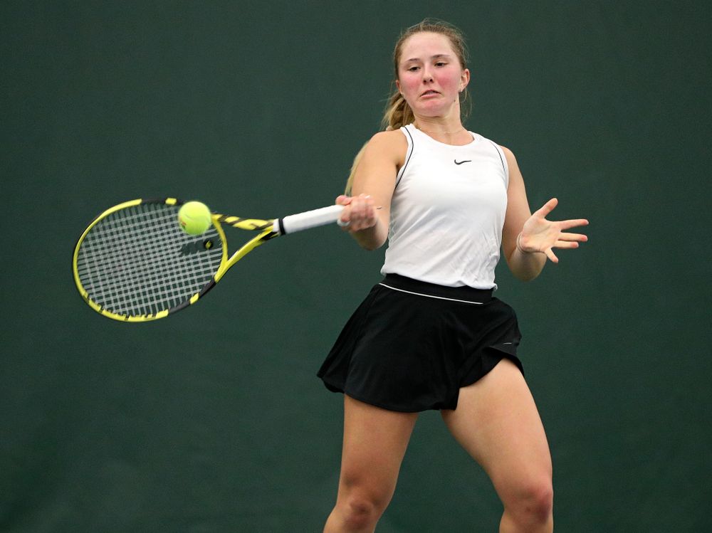 Iowa’s Danielle Burich returns a shot during her singles match at the Hawkeye Tennis and Recreation Complex in Iowa City on Sunday, February 16, 2020. (Stephen Mally/hawkeyesports.com)