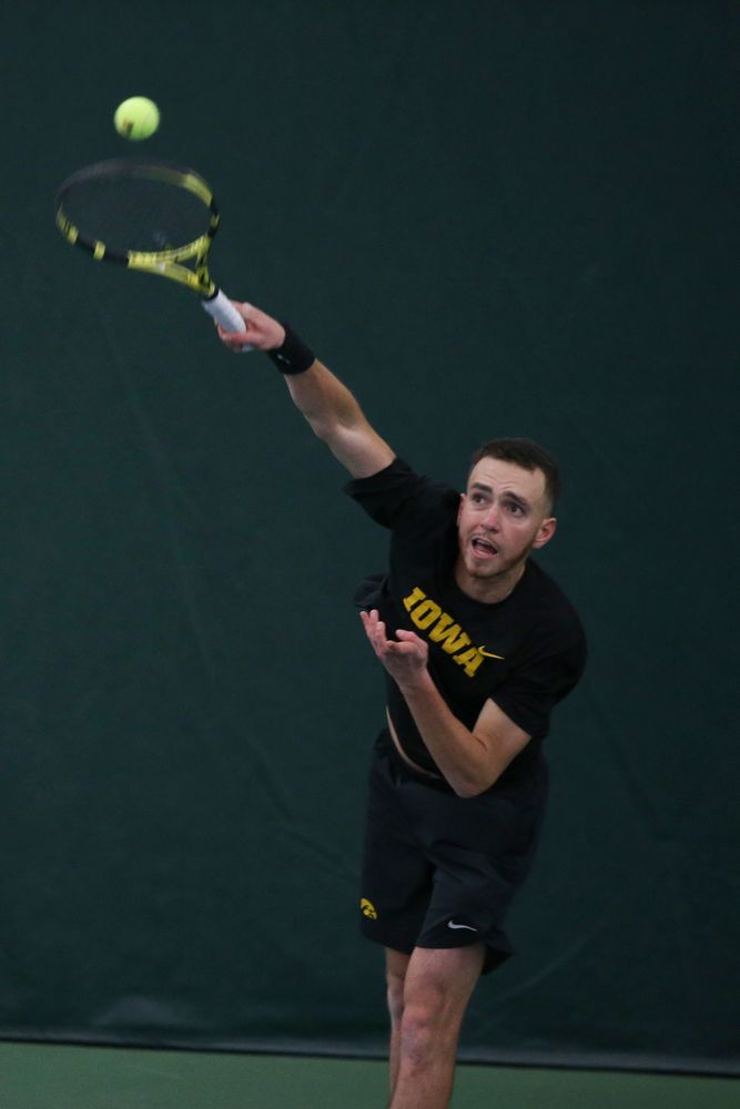 Iowa’s Kareem Allaf serves a ball during the Iowa men’s tennis meet vs VCU on Saturday, February 29, 2020 at the Hawkeye Tennis and Recreation Complex. (Lily Smith/hawkeyesports.com)