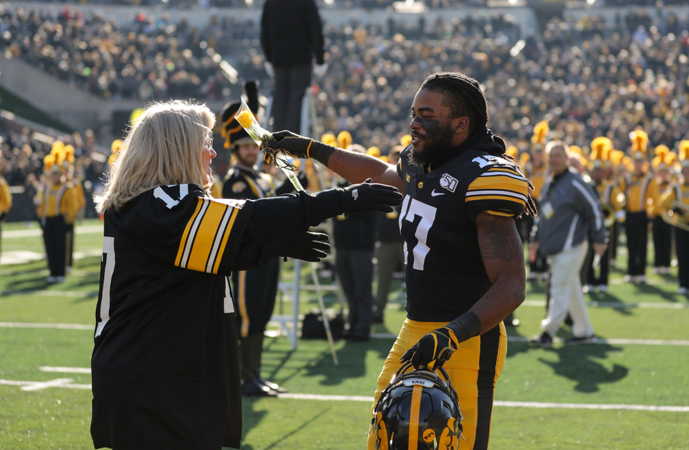 Iowa Hawkeyes defensive back Devonte Young (17) and Kirk and Mary Ferentz during Senior Day festivities before their game against the Illinois Fighting Illini Saturday, November 23, 2019 at Kinnick Stadium. (Brian Ray/hawkeyesports.com)