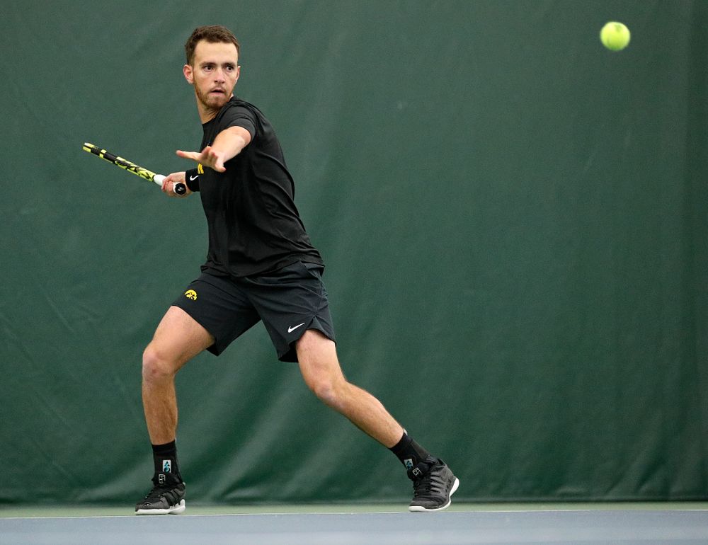 Iowa’s Kareem Allaf hits a shot during his match against Marquette at the Hawkeye Tennis and Recreation Complex in Iowa City on Saturday, January 25, 2020. (Stephen Mally/hawkeyesports.com)