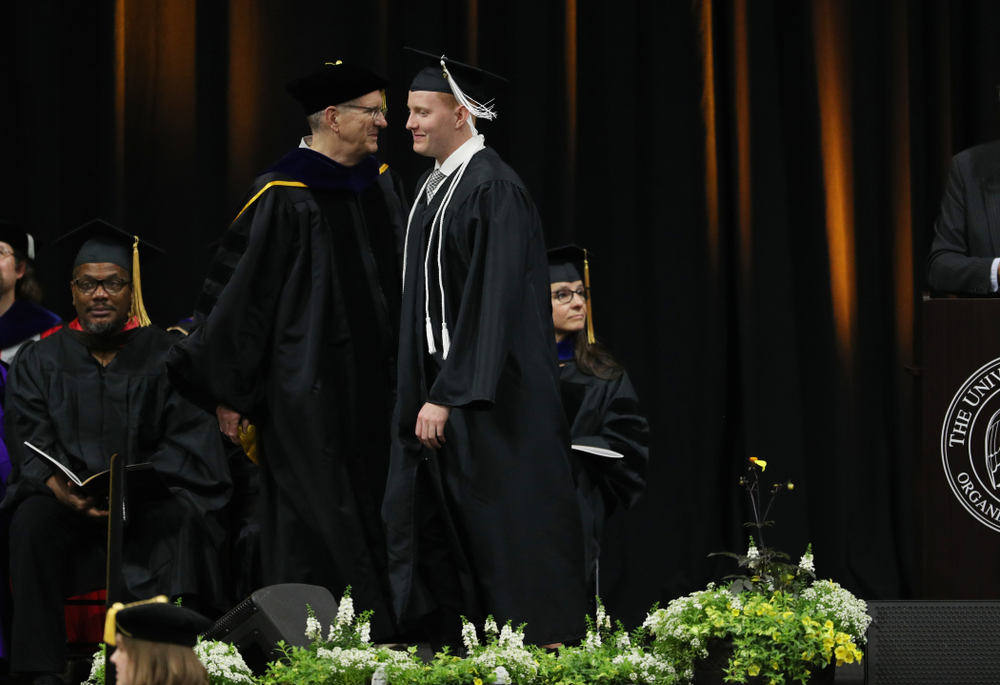 Iowa MenÕs Basketball Manager Trevor Smith during the College of Liberal Arts and Sciences spring commencement Saturday, May 11, 2019 at Carver-Hawkeye Arena. (Brian Ray/hawkeyesports.com)
