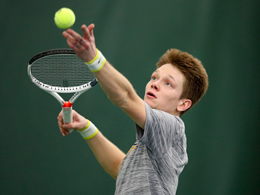 Iowa’s Jason Kerst serves during their match at the Hawkeye Tennis and Recreation Complex in Iowa City on Thursday, January 16, 2020. (Stephen Mally/hawkeyesports.com)