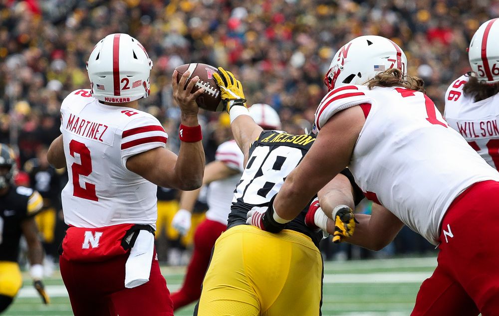Iowa Hawkeyes defensive end Anthony Nelson (98) knocks the ball out of the quarterback's hand during a game against Nebraska at Kinnick Stadium on November 23, 2018. (Tork Mason/hawkeyesports.com)